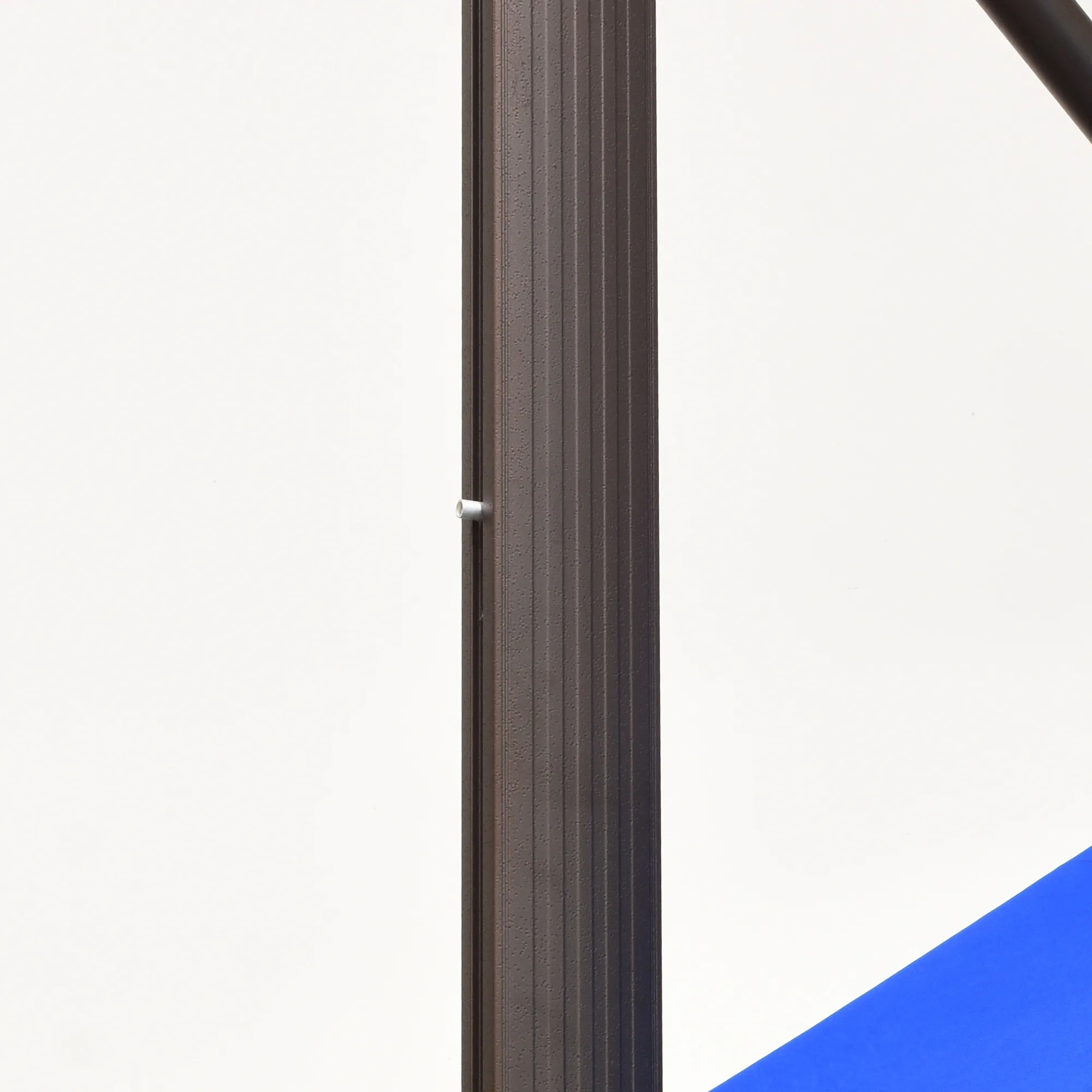 A close-up image of the Cali Series Residential Cantilever Patio Umbrella by California Umbrella, featuring a strong, weather-resistant aluminum center pole designed for long-lasting durability in outdoor spaces.