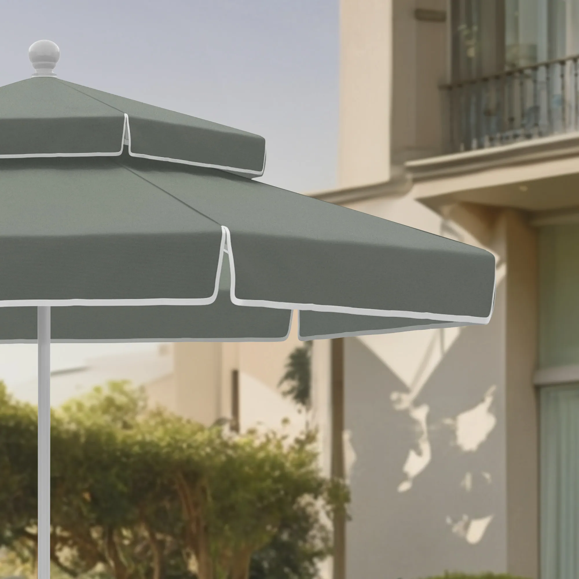 An image capturing the distinctive double-tier canopy of the Terrace Series Patio Umbrella by California Umbrella, designed to enhance airflow while adding an elegant and stylish touch to outdoor spaces